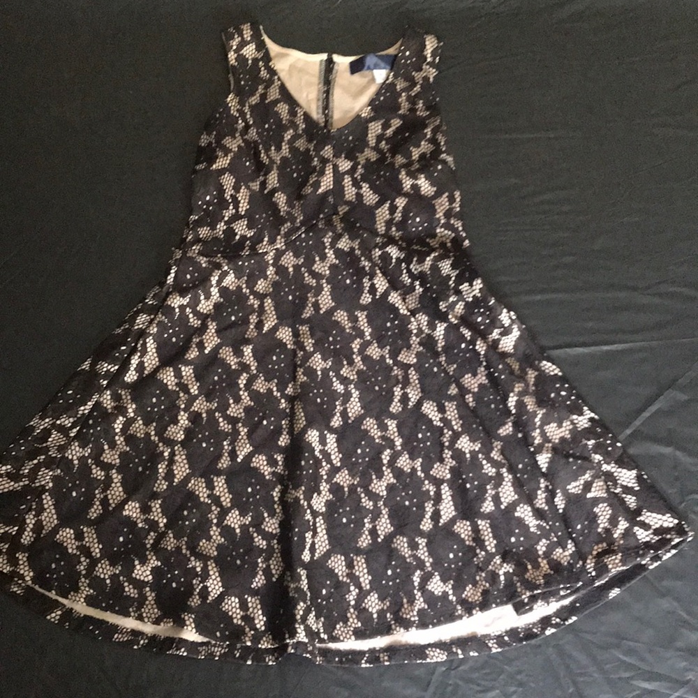 Black with nude under tone. Great night dress